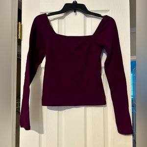 Purple long-sleeve athletic shirt